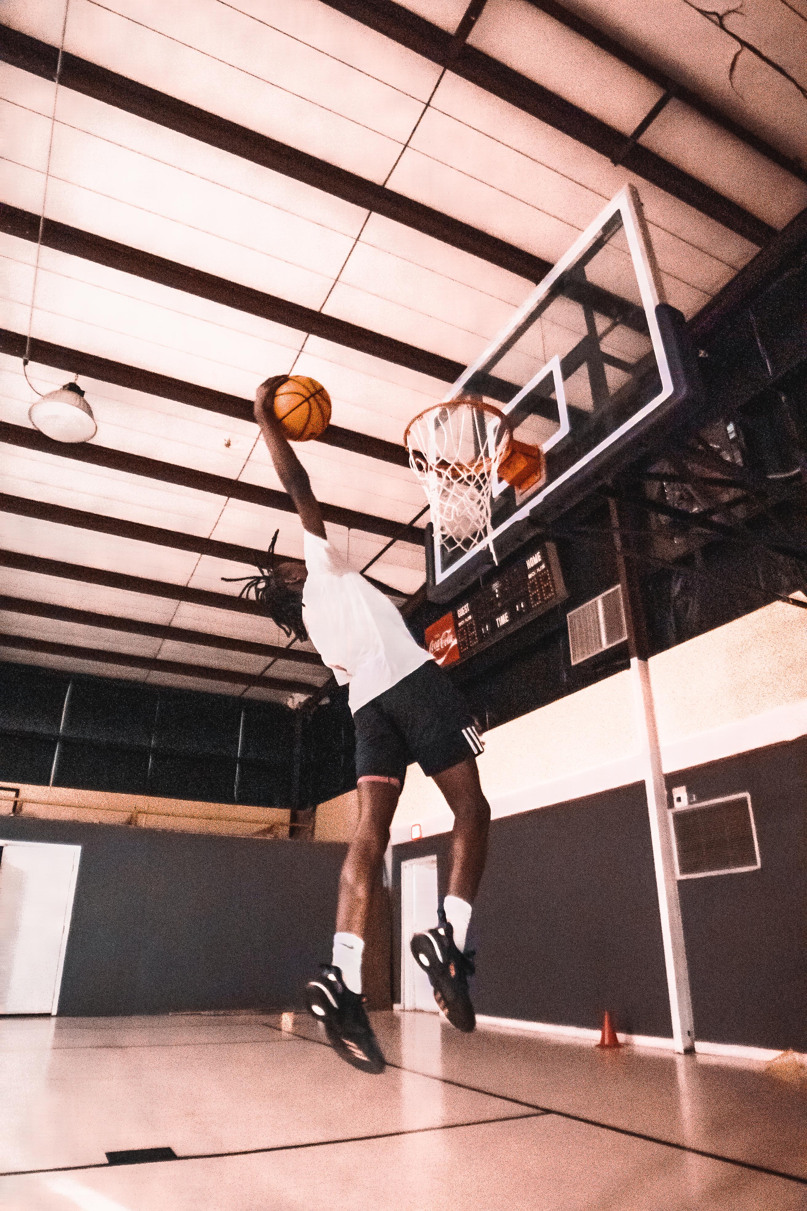 Basketball player dunking ball